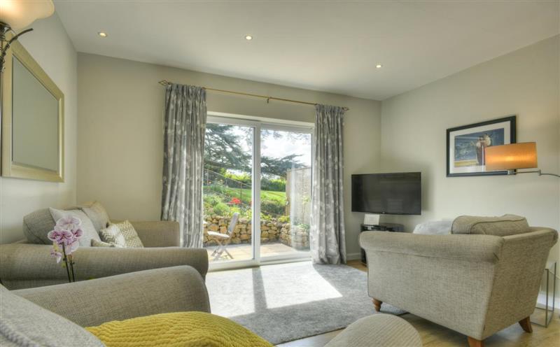 Relax in the living area at The Bramleys, Old Cleeve