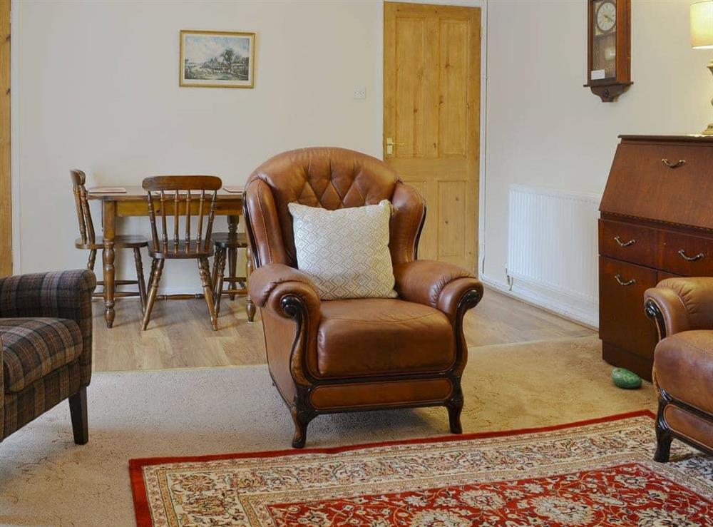 Living room/dining room at The Bridge Inn Flat in Bridgerule, near Bude, Devon