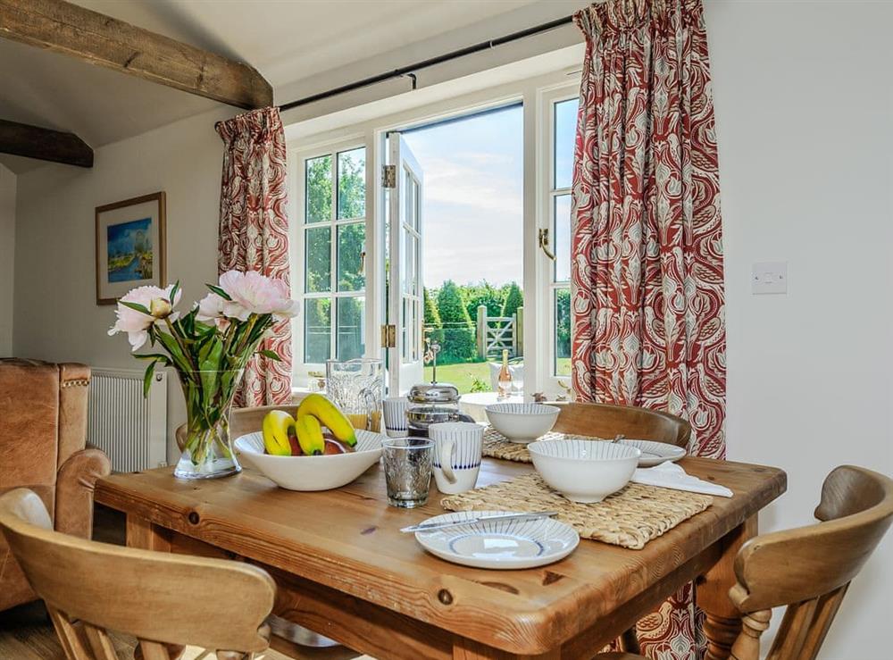 Dining area with French doors at The Bull Pen in Lawford, Essex, England