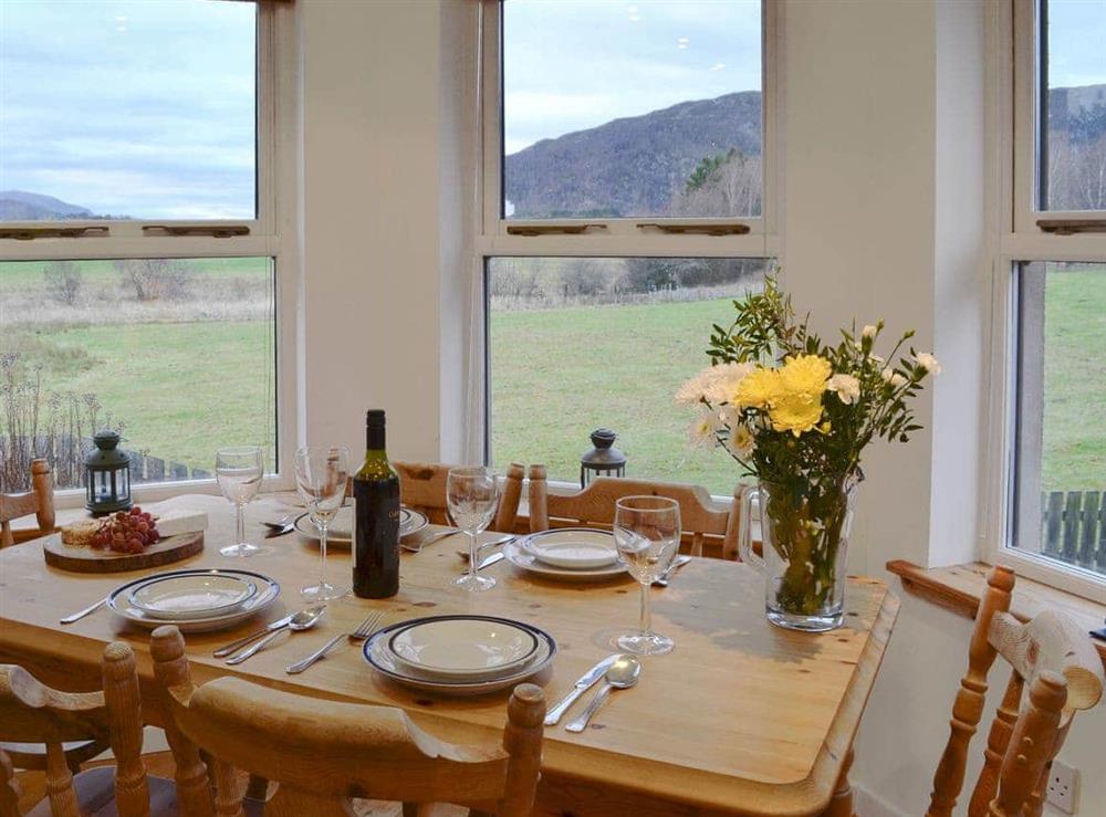 Light and airy dining area in the sun room at The Bungalow in Aviemore, Speyside, Inverness-Shire