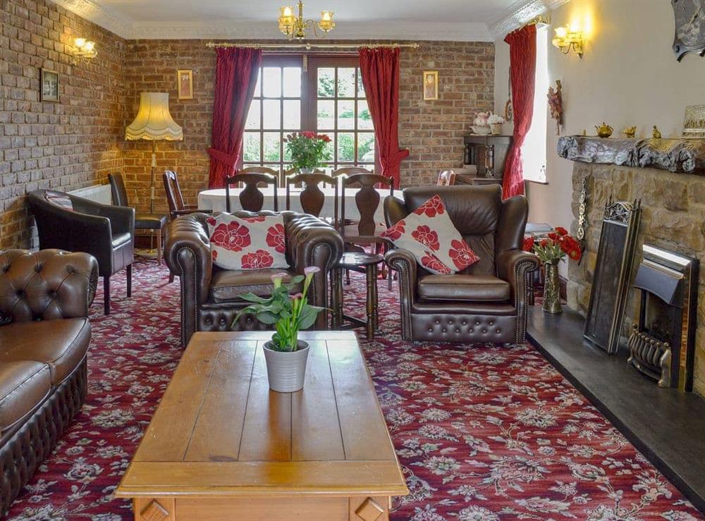 Comfortable living/ dining room at The Bungalow in Lebberston, near Filey, North Yorkshire