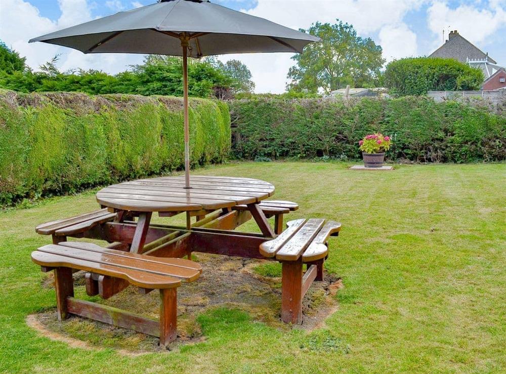 Peacful garden with sitting out area at The Bungalow in Lebberston, near Filey, North Yorkshire
