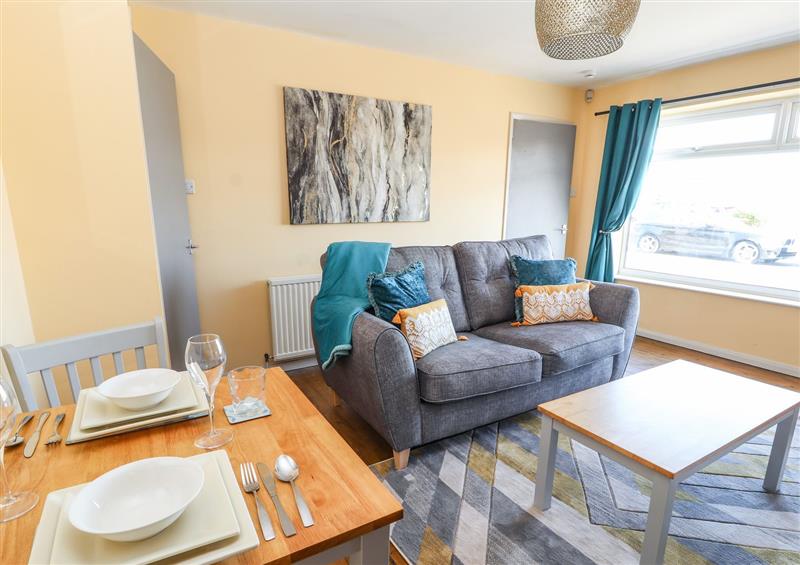 Relax in the living area at The Bungalow, Towyn
