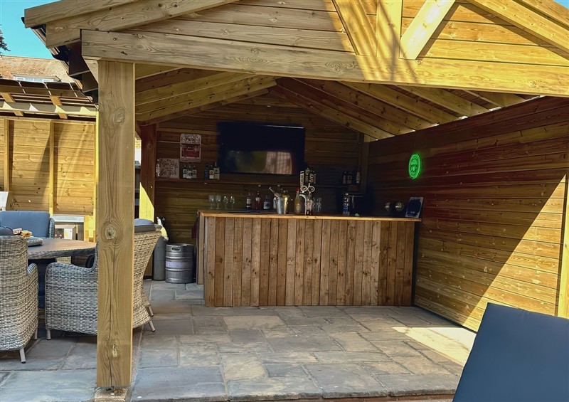 Enjoy a glass of wine on the patio at The Burleigh, Hunstanton