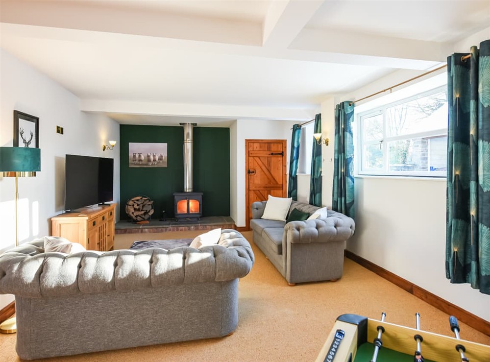 Living area at The Byre at Woodgate Farm in Church Stretton, Shropshire
