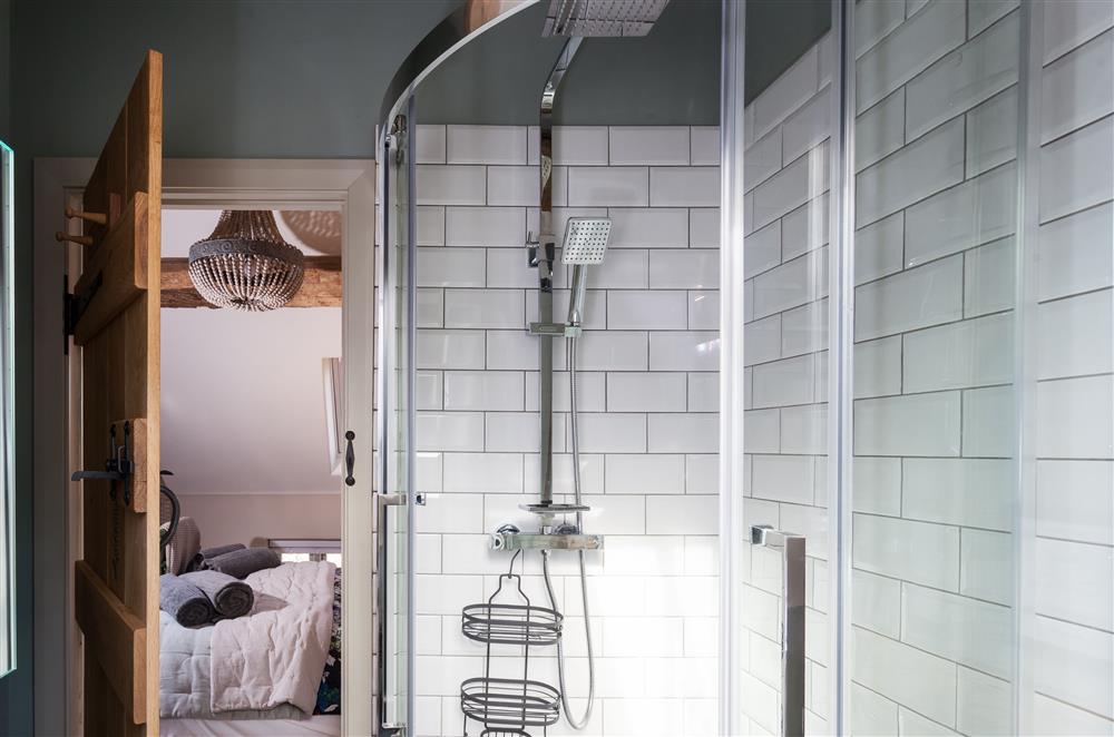 Bedroom one’s en-suite shower room with a walk-in shower and underfloor heating at The Byre, Bridgnorth