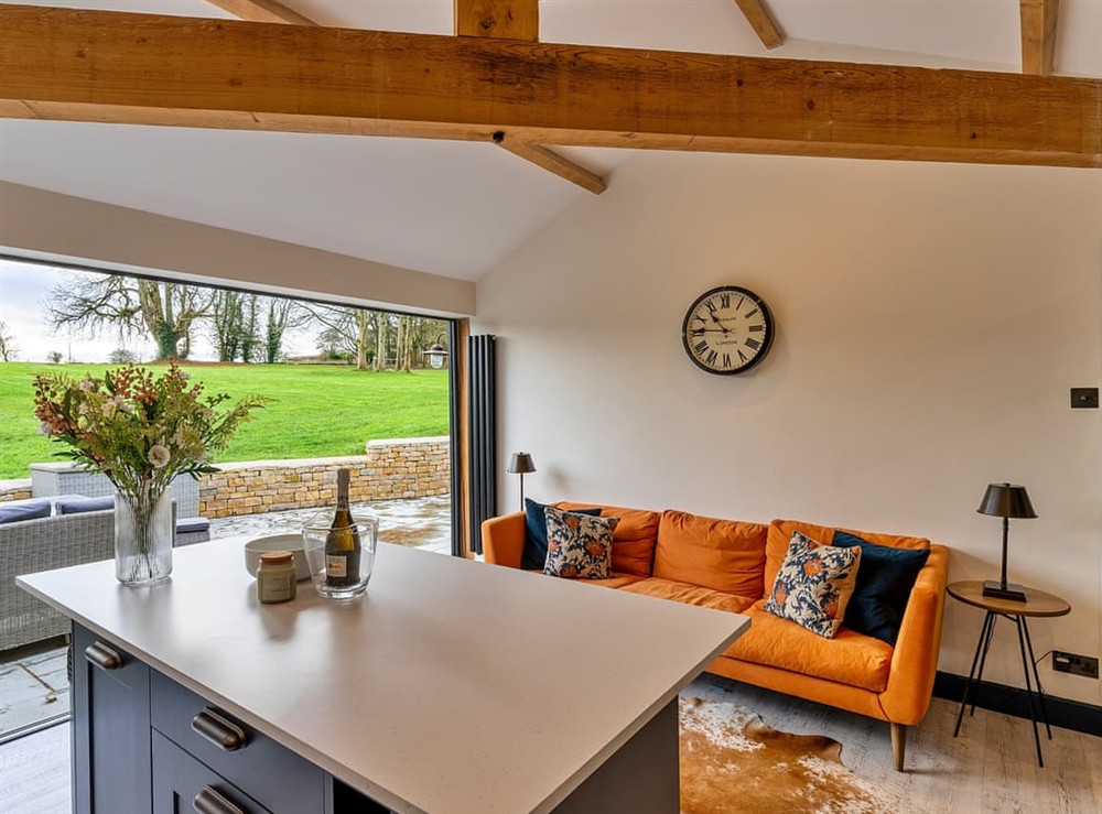 Open plan living space at The Cabin at Hill Rise in Bourton-on-the-Water, Gloucestershire
