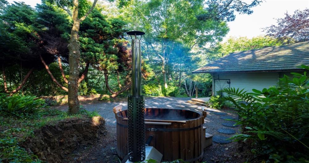 Private wood-fired hot tub in the woods! at The Cabin in Penzance