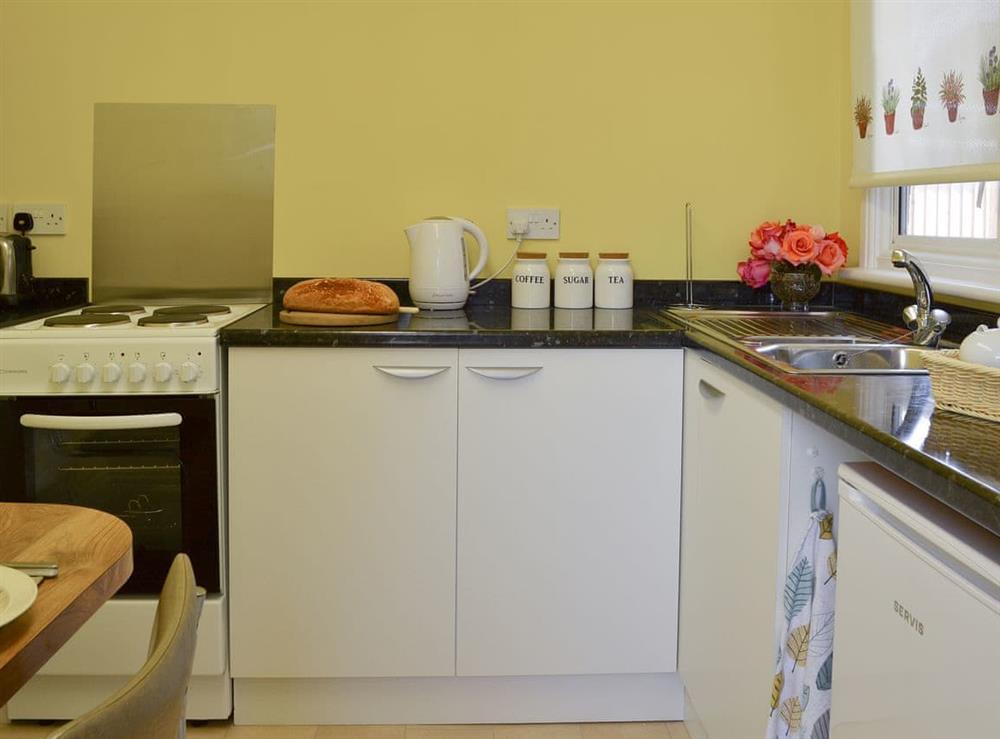Kitchen with dining area (photo 2) at The Cabin in Pevensey Bay, near Eastbourne, East Sussex