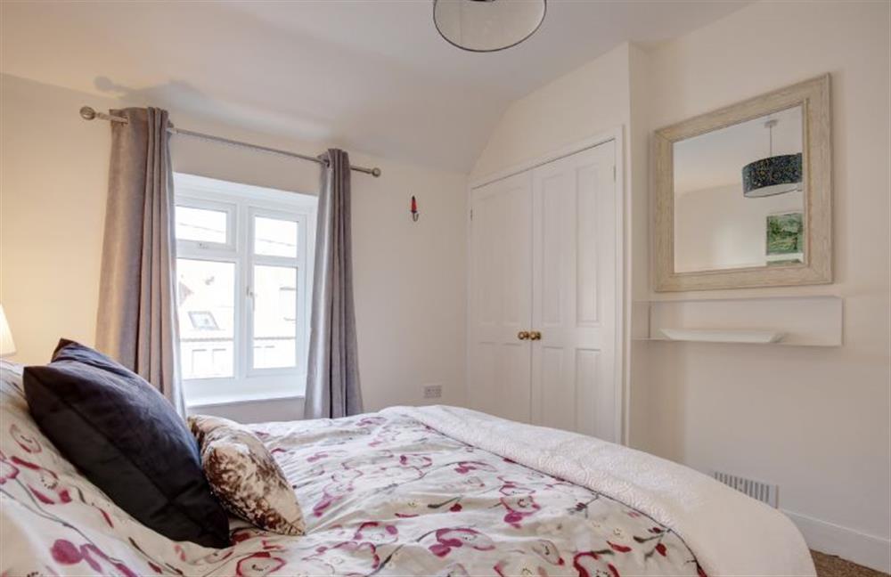 First floor: Double bedroom with built in wardrobe at The Cabin, Wells-next-the-Sea