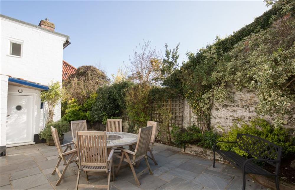 Private and spacious courtyard garden with seating for six at The Cabin, Wells-next-the-Sea