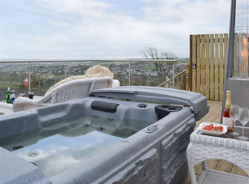 Raised decked balcony with gorgeous hot tub at The Calving Shed in Near Neilston, Lanarkshire