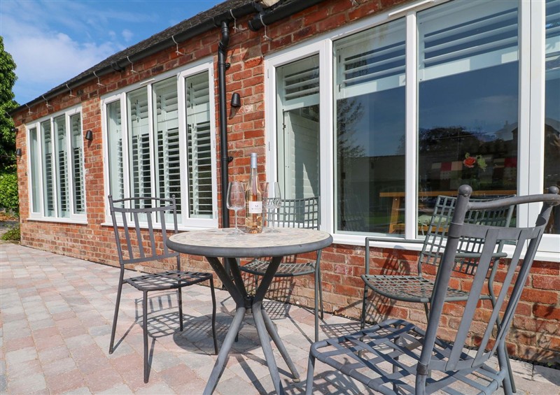 Enjoy a cup of tea on the patio at The Canalside Cottage, Shardlow near Castle Donington
