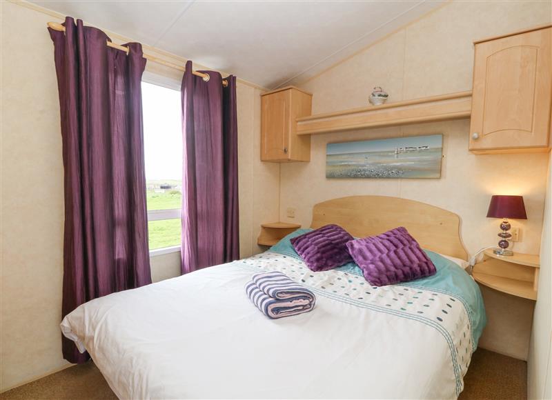 A bedroom in The Caravan @ Lletty'r Wennol at The Caravan @ Llettyr Wennol, Cemaes Bay