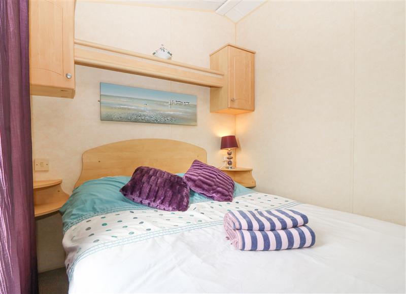 This is a bedroom at The Caravan @ Llettyr Wennol, Cemaes Bay