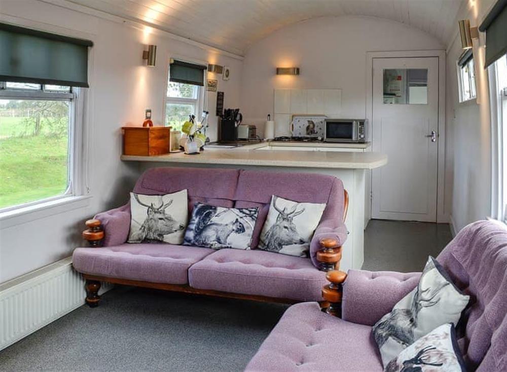 Living area with comfortable and cosy seats at The Carriage in 