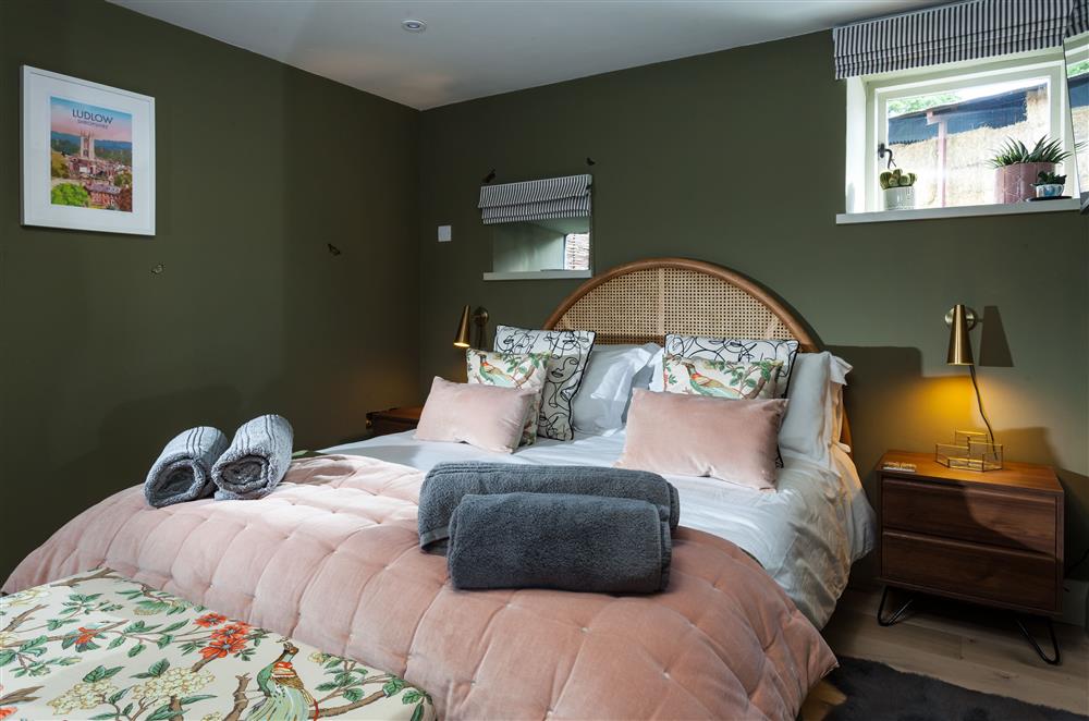 Bedroom one on the ground floor with a 5’ king-size bed and en-suite wet room at The Cart House, Bridgnorth