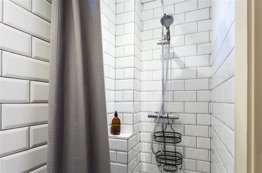 Bedroom one’s en-suite wet room with a tiled shower at The Cart House, Bridgnorth