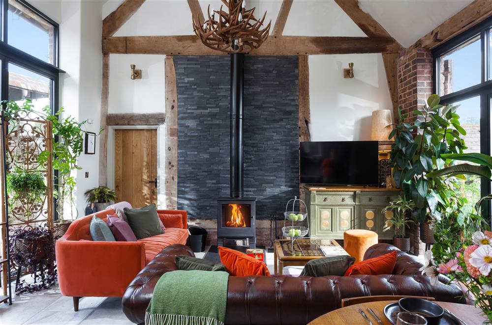 Elegant sitting room with exposed beams and stonework at The Cart House, Bridgnorth