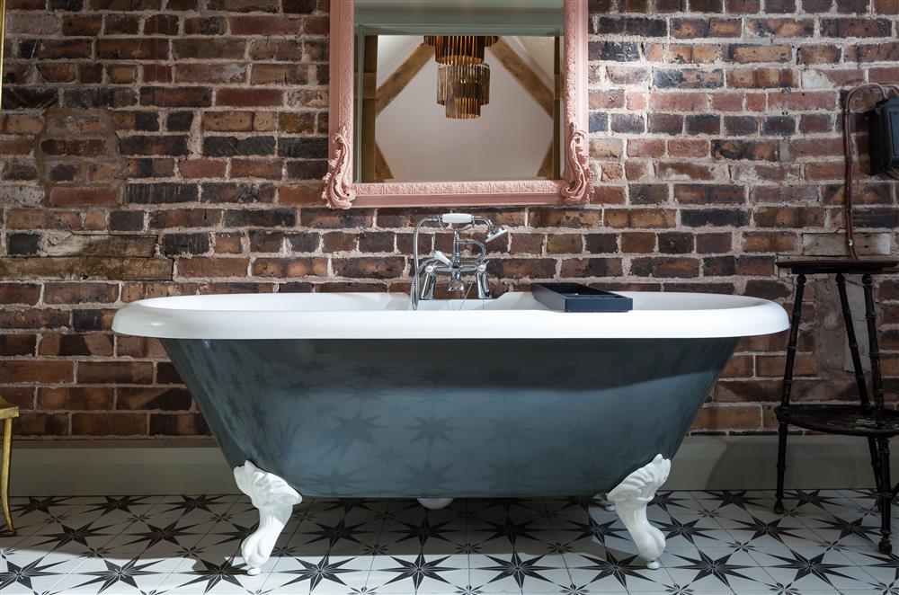 Exquisite claw-foot, free-standing bath in bedroom two’s en-suite bathroom at The Cart House, Bridgnorth