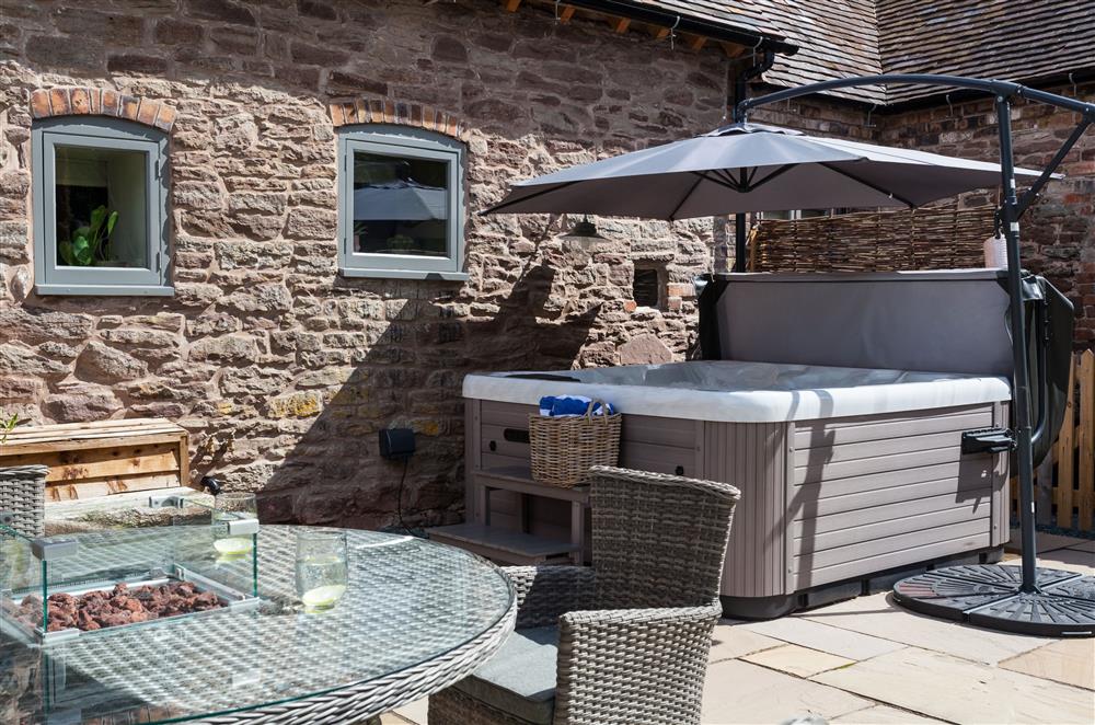 Relax in the hot tub after a day exploring the local area at The Cart House, Bridgnorth