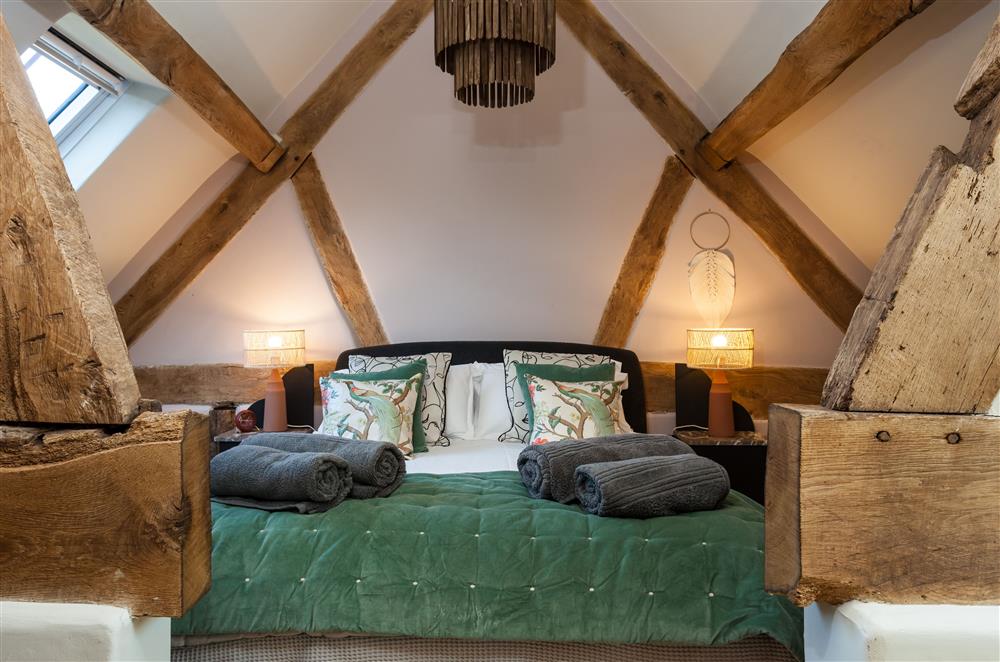 The beauty of bedroom two on the first floor with a 5’ king-size bed and en-suite bathroom at The Cart House, Bridgnorth
