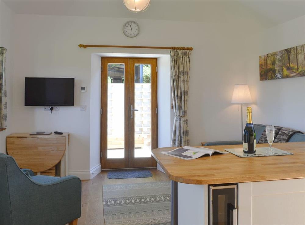 Comfortable open plan living space at The Cart Linhay in Meshaw, near South Molton, Devon