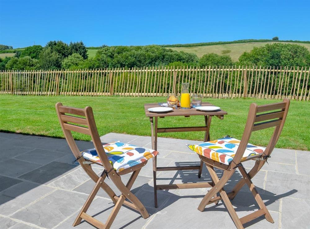 Delightful sitting out area with countryside views at The Cart Linhay in Meshaw, near South Molton, Devon