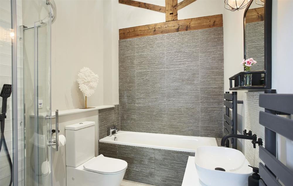 Master en-suite bathroom with bath and separate shower at The Cart Shed, Downton-on-the-Rock