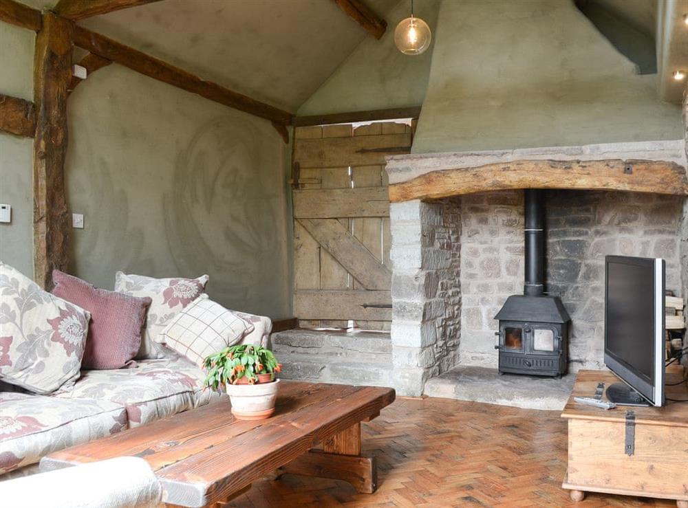 Cosy living room with wood burner at The Cart Shed in Knapton Green, near Leominster, Herefordshire