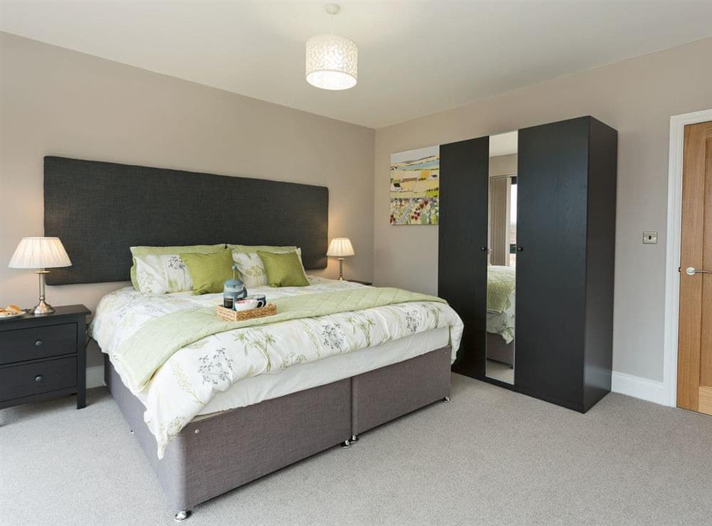 Spacious master bedroom with en-suite shower room at The Cart Shed in Witton Gilbert, near Durham, England