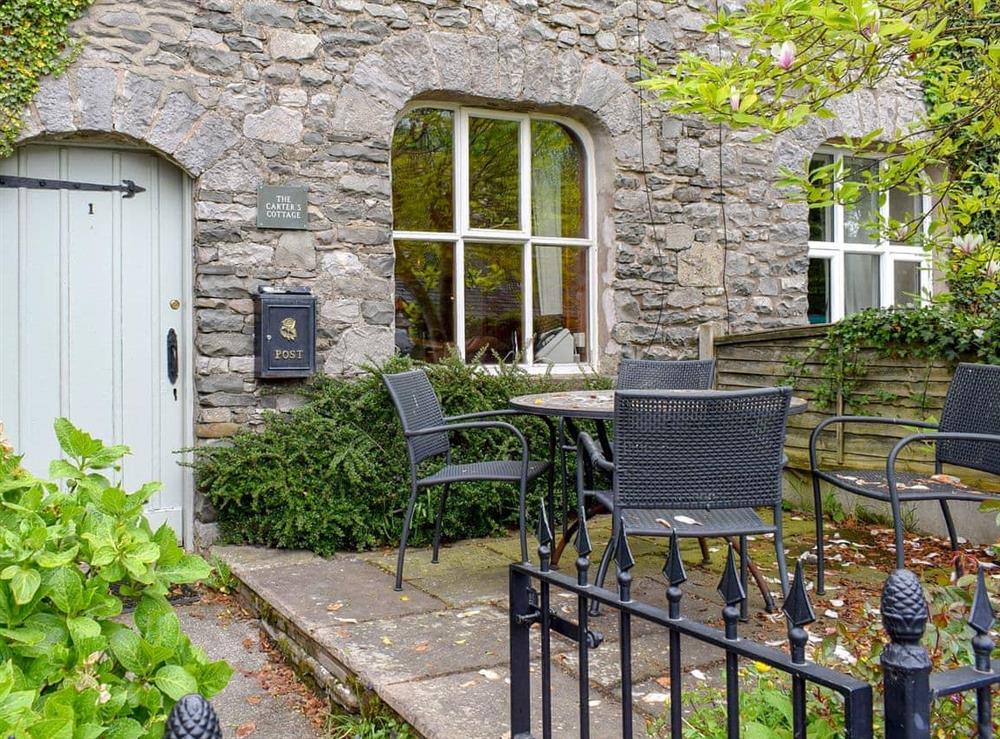 Enclosed patio with furniture at The Carters Cottage in Sedgwick, near Kendal, Cumbria