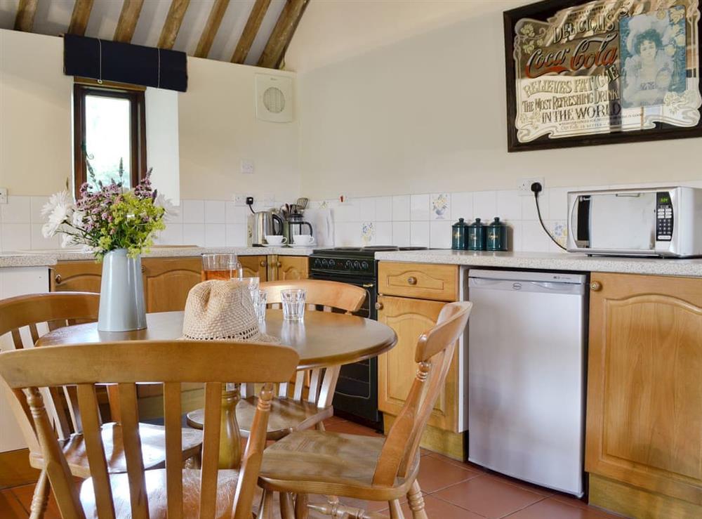 Well equipped kitchen/ dining area at The Carthouse in Malmesbury, Wiltshire