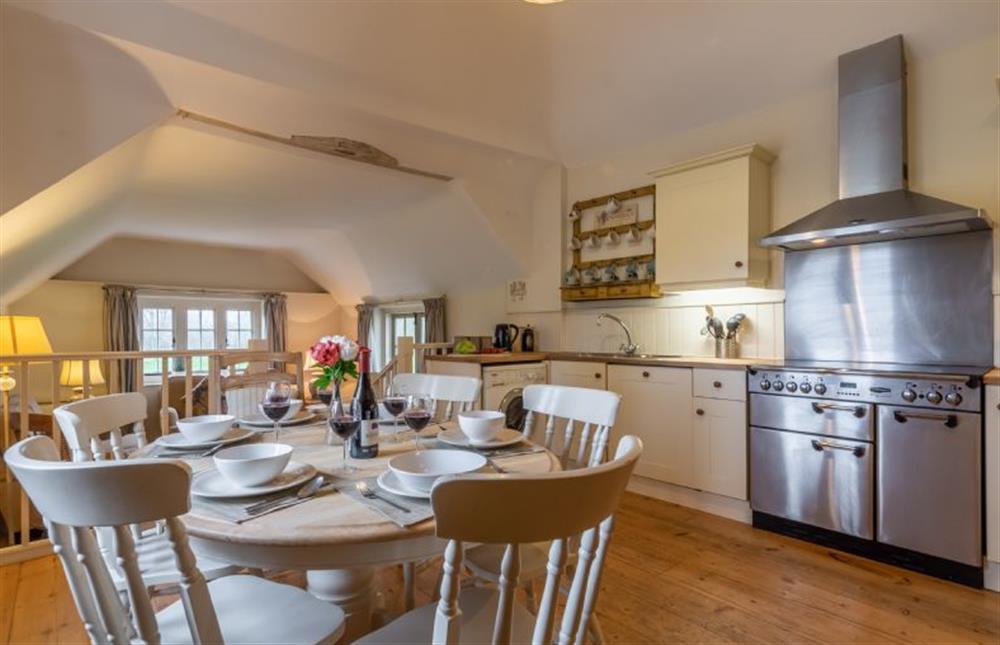 Open-plan kitchen and dining room leading to living space at The Cartlodge, Higham