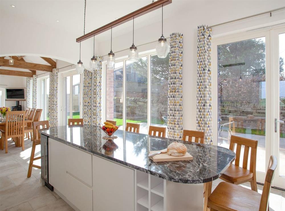 Modern kitchen adjoins the living and dining areas at The Cartshed in Slindon, near Eccleshall, Staffordshire