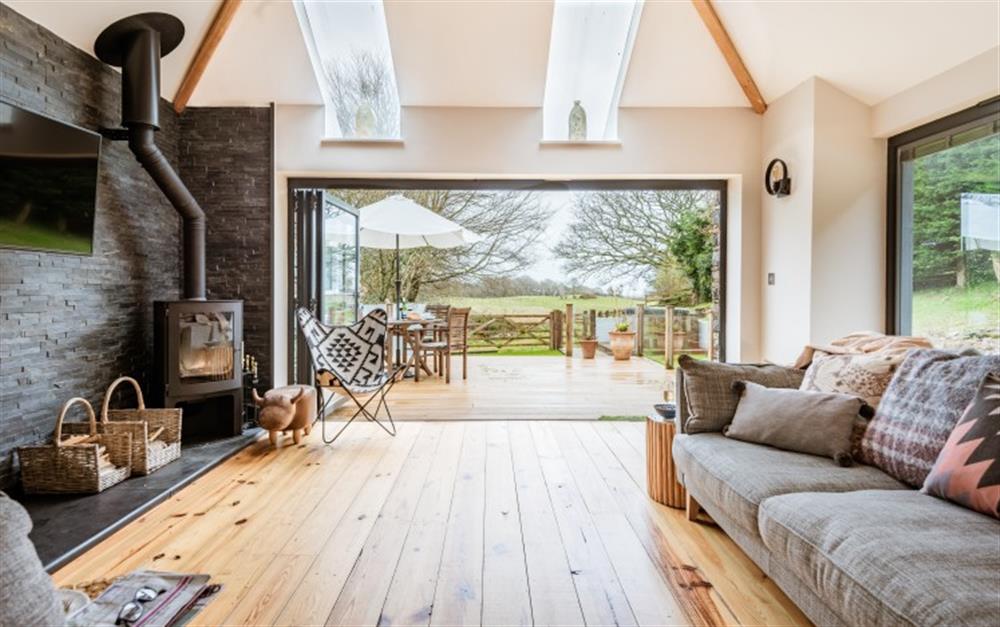Relax in front of a cozy log burner and luscious green fields.  at The Cattle Shed in Chillington