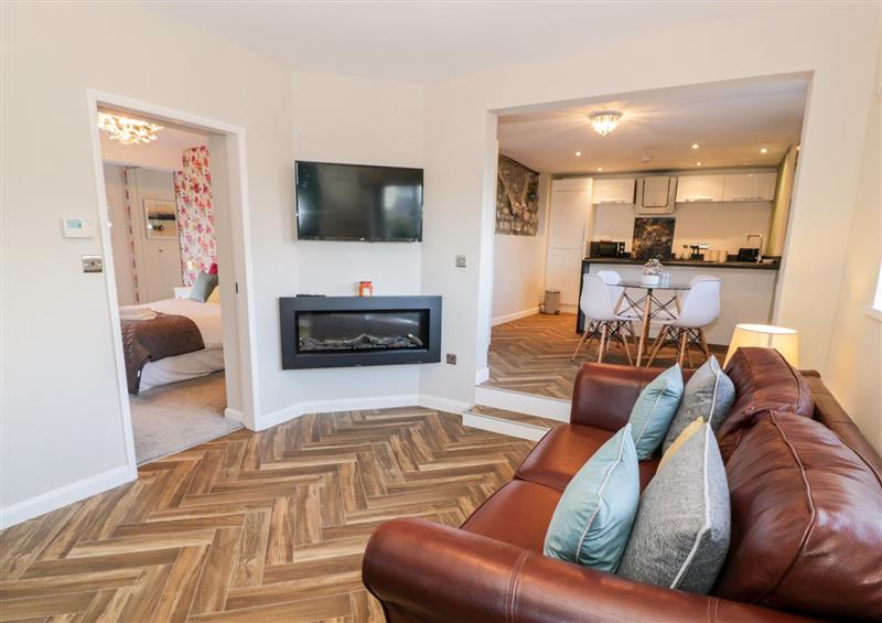 Relax in the living area at The Chalet, Benllech