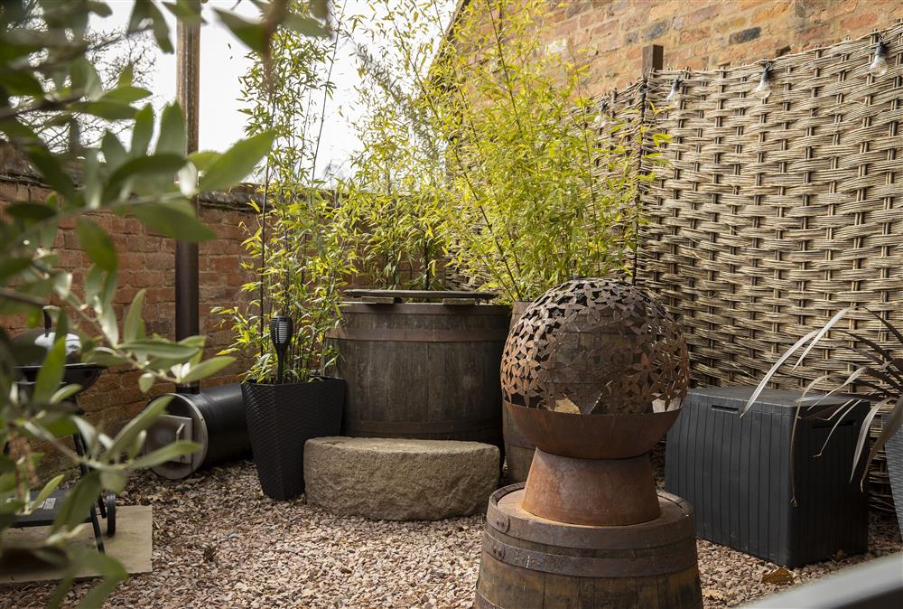 Private outdoor area with wood-fired sherry barrel hot tub at The Chapel, Finstall nr Bromsgrove