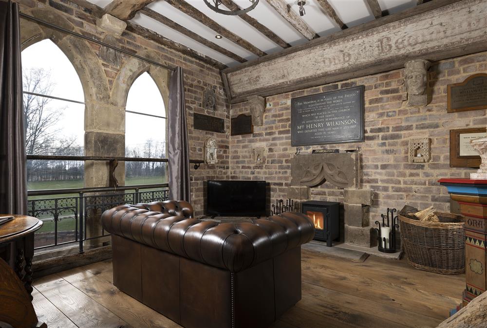 Sitting room with wood burning stove at The Chapel, Finstall nr Bromsgrove