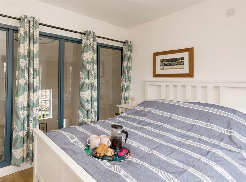 Double bedroom with view over living area at The Chapel in Hindolveston, near Holt, Norfolk