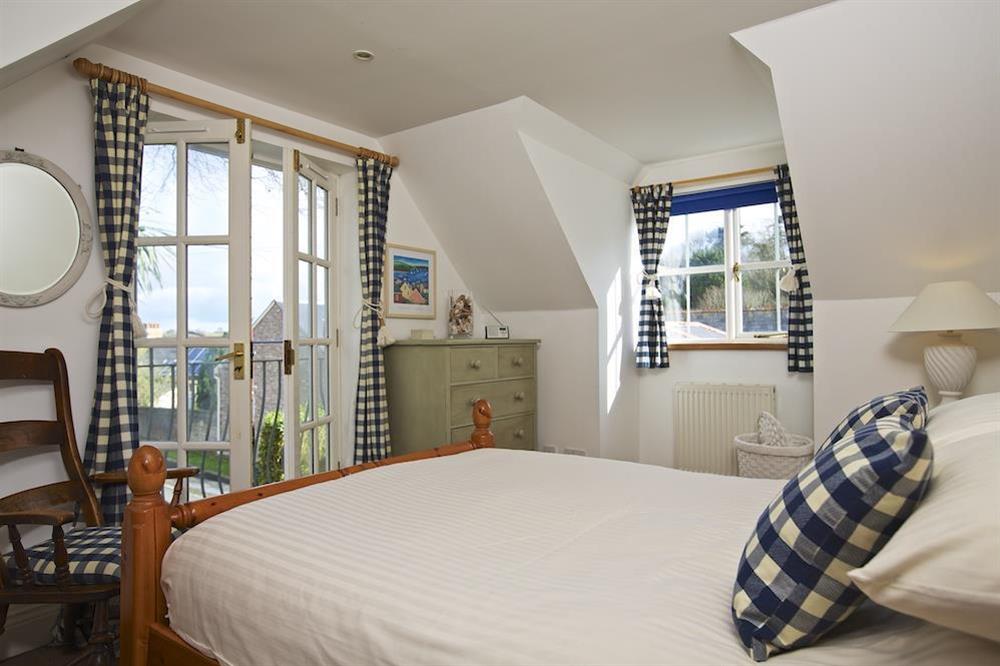 En suite double bedroom with Juliet balcony at The Chota House in Shadycombe Road, Salcombe