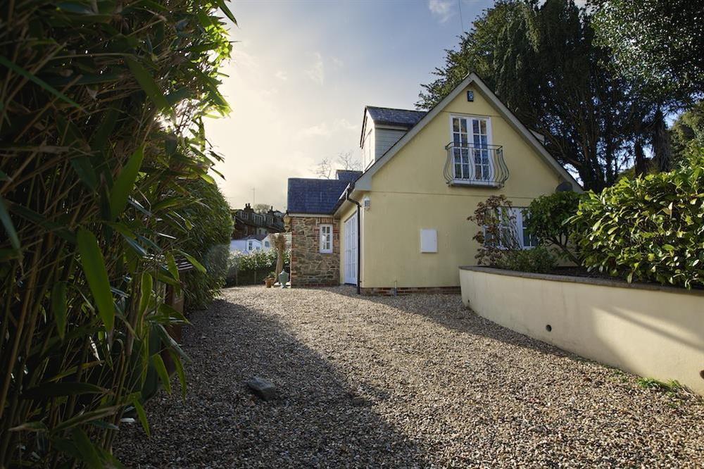 Gravelled driveway, surrounded by attractive trees and shrubs at The Chota House in Shadycombe Road, Salcombe