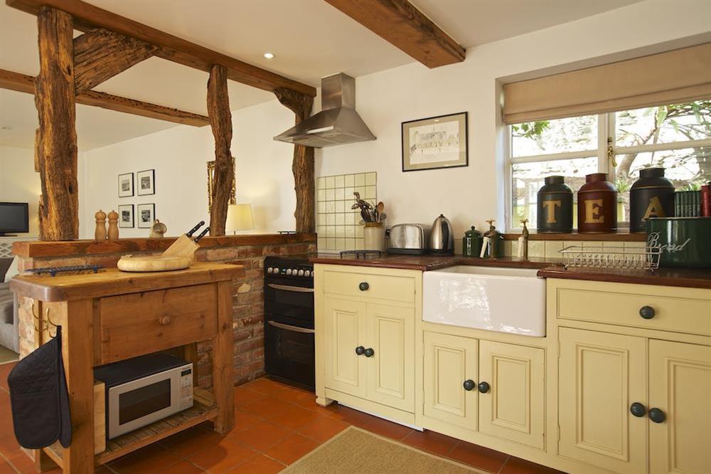 Well-equipped kitchen area with central island unit at The Chota House in Shadycombe Road, Salcombe