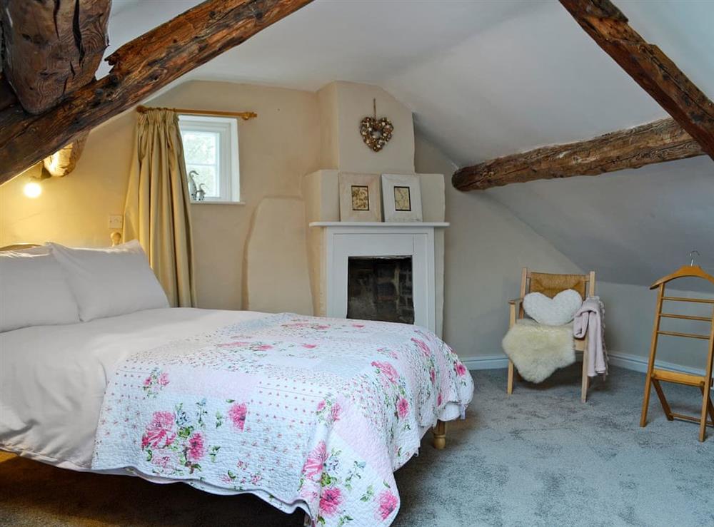 Romantic double bedroom with beams at The Cider Barn in Combe, near Presteigne, Herefordshire