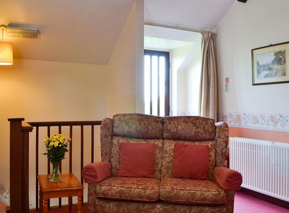 Comfortable seating on first floor landing at The Cider Mill Cottage in Orleton, near Ludlow, Shropshire