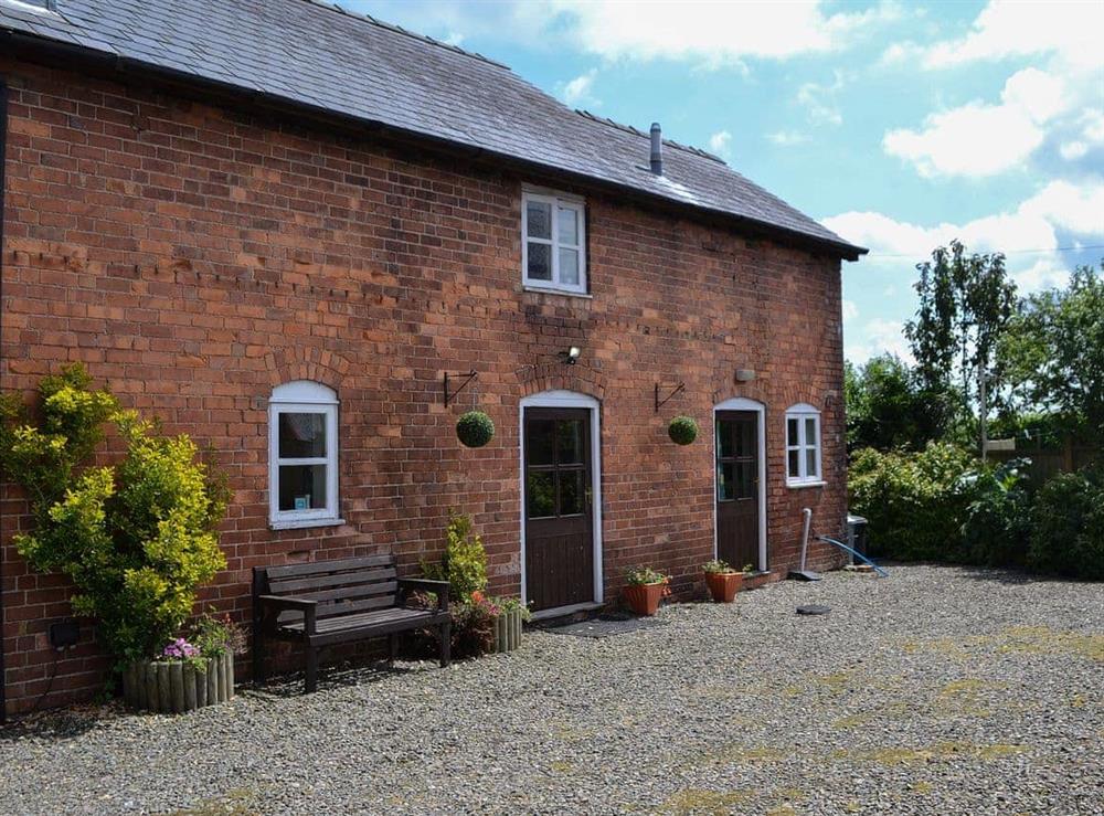 Gravelled forecourt and imposing brick-built property at The Cider Mill Cottage in Orleton, near Ludlow, Shropshire