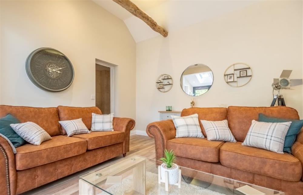 Relax in the bright and airy sitting room  at The Clockhouse, North Lopham