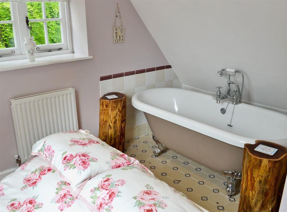 Double bedroom with roll-top bath and en-suite (photo 2) at The Coach House @ The Old Rectory in Buckland St Mary, near Chard, Somerset