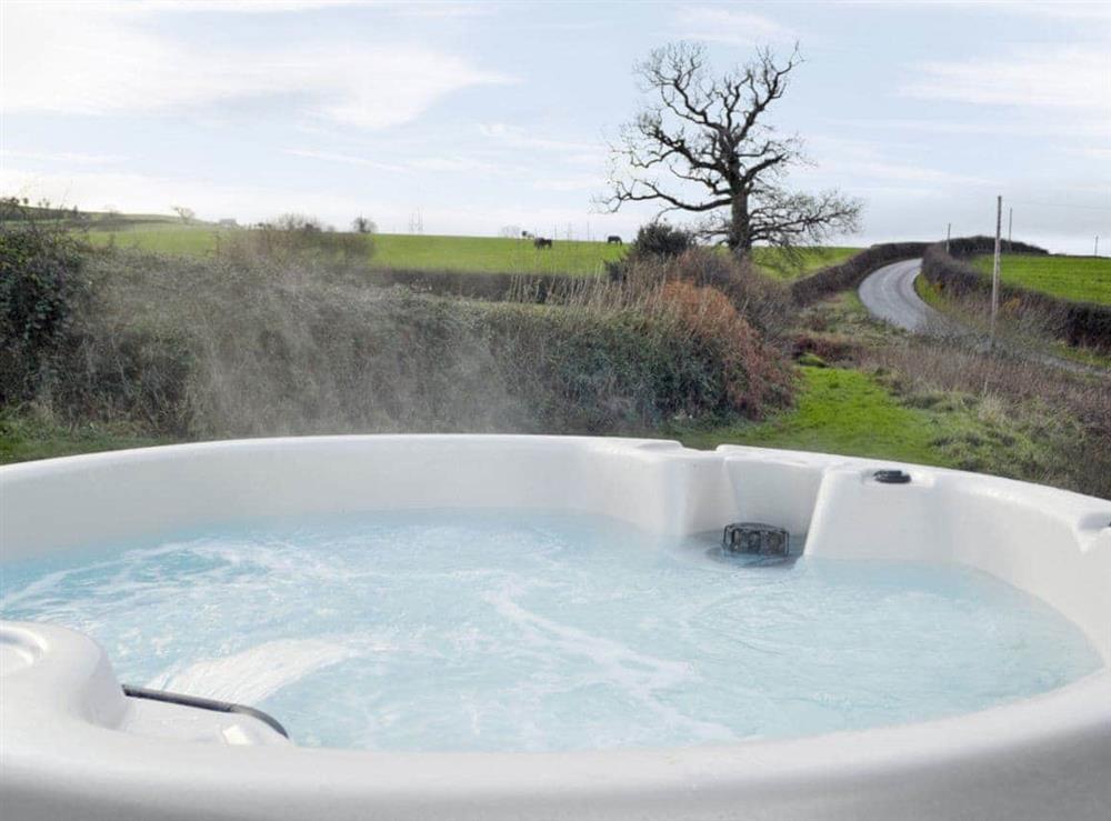 Relaxing hot tub at The Coach House in Abergele, Clwyd