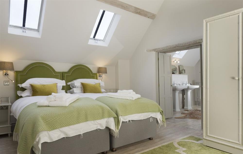 Bedroom two with a super-king size zip and link bed which can be set up as twin beds if required at The Coach House and Stables at The Lammas, Minchinhampton